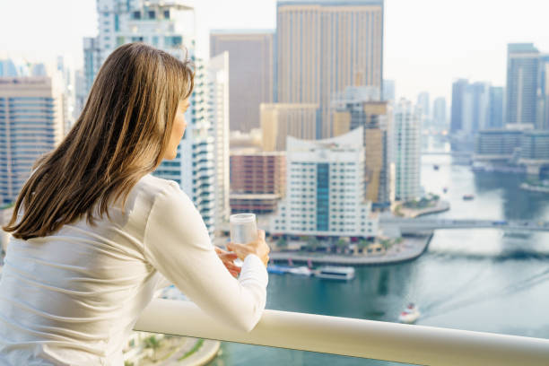 istock Woman on a highrise balcony 821327222