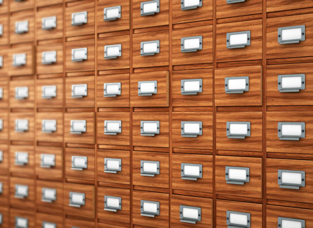 File cabinets or catalogue drawers inside the laptop screen. Folders standing inside the drawer.