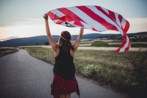 istock Woman holding national flag 821333884