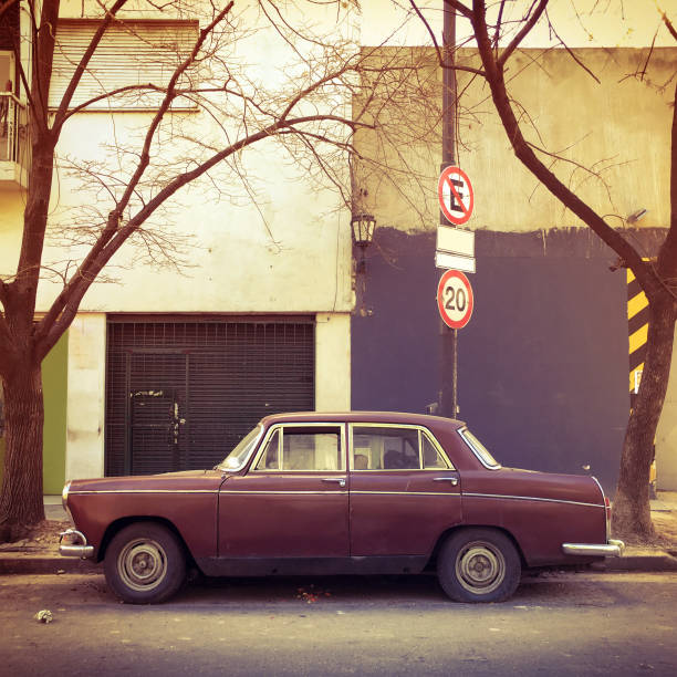 Old car parked in the street Vintage car parked in the street in Buenos Aires, Argentina baseball rundown stock pictures, royalty-free photos & images