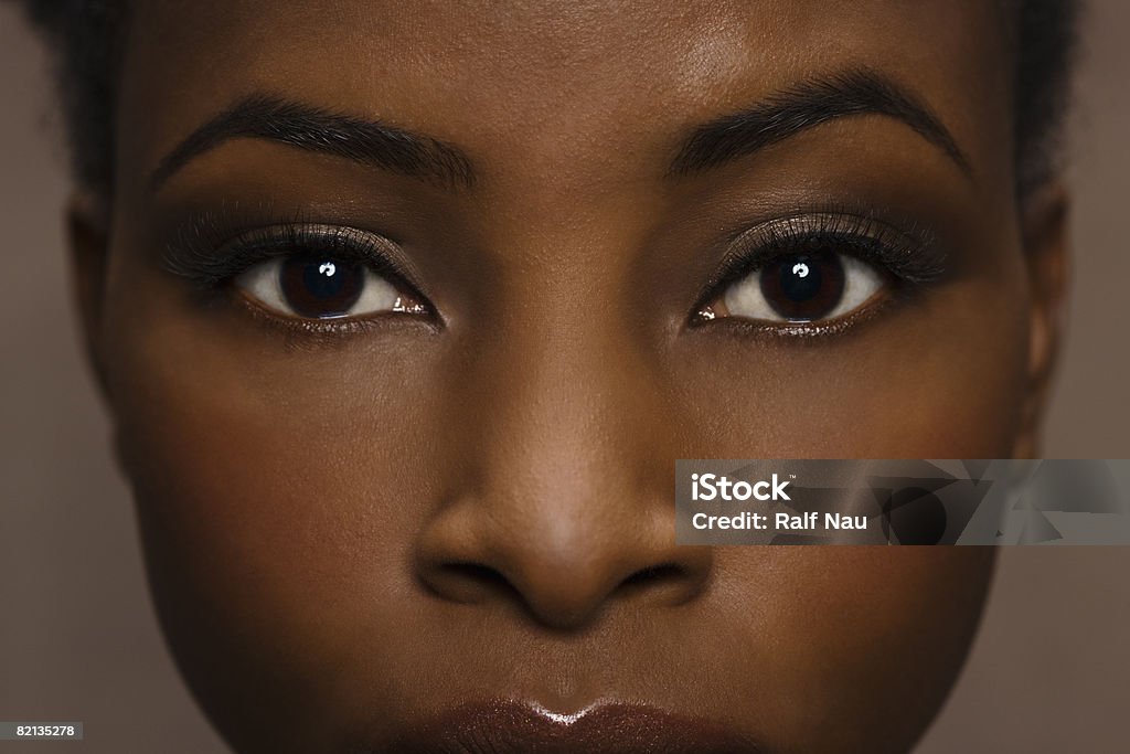  Natural Beauty Portrait Afro-American woman with flawless skin and long eyelashes Close-up Stock Photo