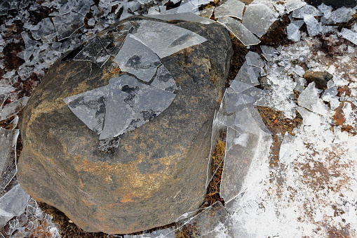 Detail of brittle ice smashed on the floor-stone at the bottom of small cove in Sildpolltjonna bay-S.shore Sildpollnes peninsula-Austnesfjorden. Vagan kommune-Austvagoya-Lofoten-Nordland fylke-Norway