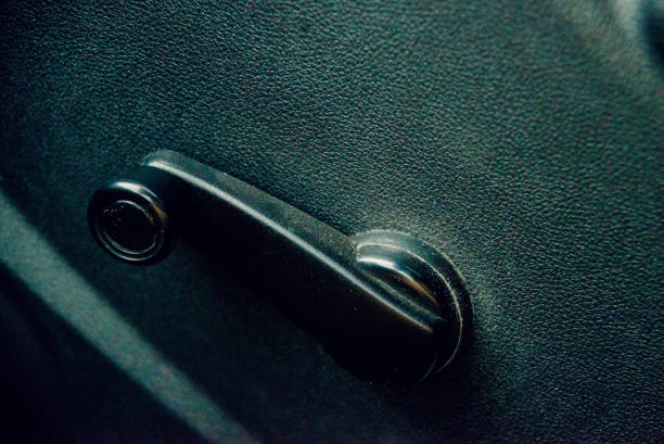 istock Car door inside with door handle and manual door window regulator 821353480