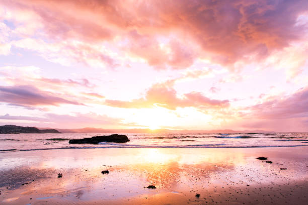 istock Sunset above the sea and a mountain range 821359578
