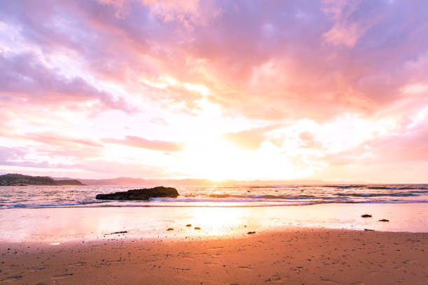 istock Sunset above the sea and a mountain range 821359586
