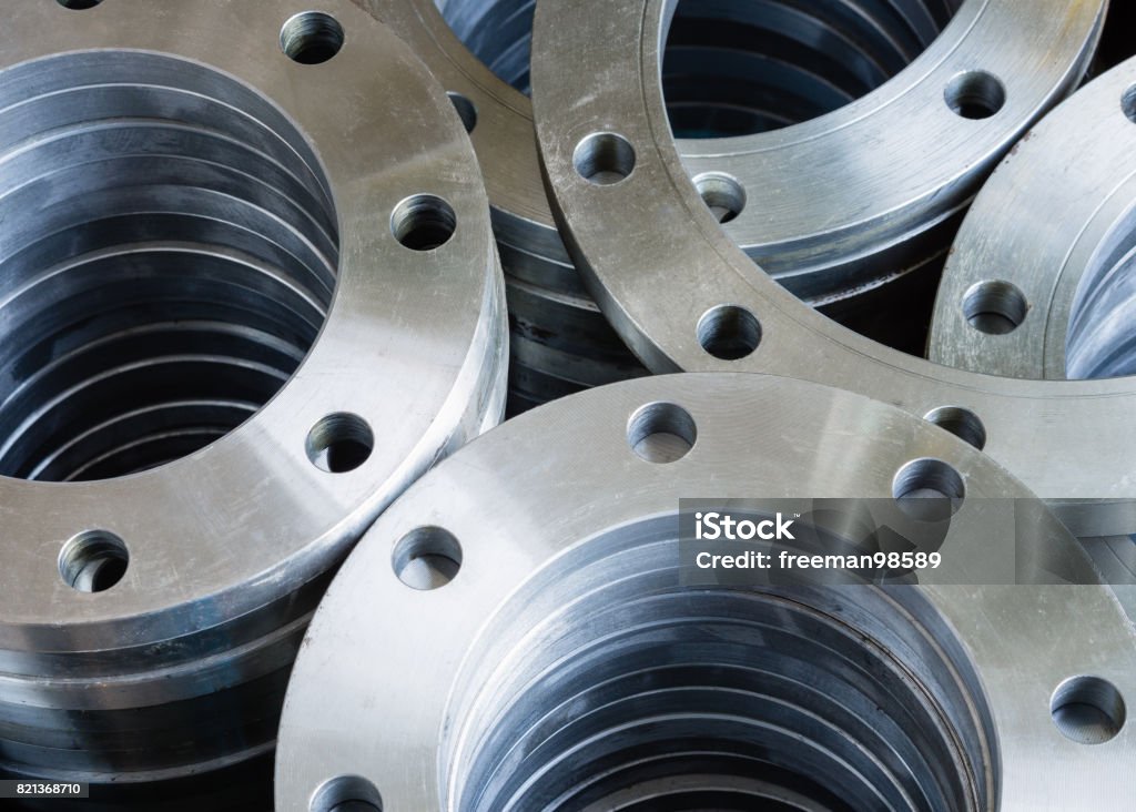 Flanges Flanges,welding flange used in industrial water pipes.selective focus. Pipe - Tube Stock Photo