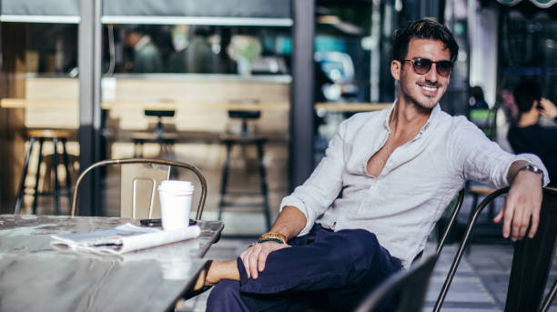 istock Attractive man relaxing in coffee shop 821368914
