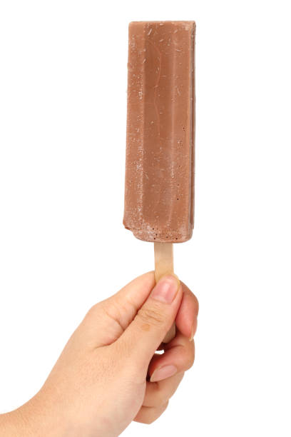 istock popsicle in hand isolated on a white background 821376600