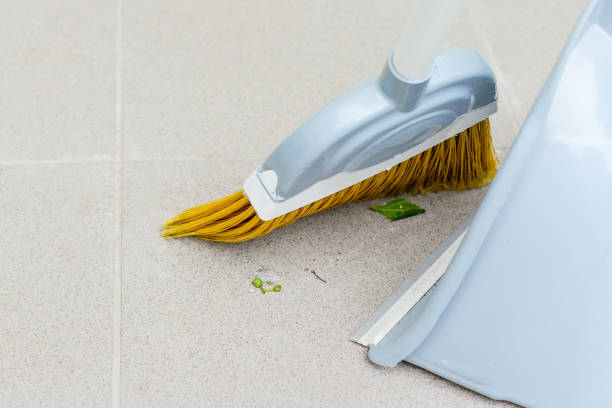 istock Smoothing on a tile with a broom to a bucket 821392042