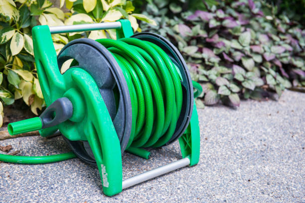 istock Roll the watering hose in the garden 821392700