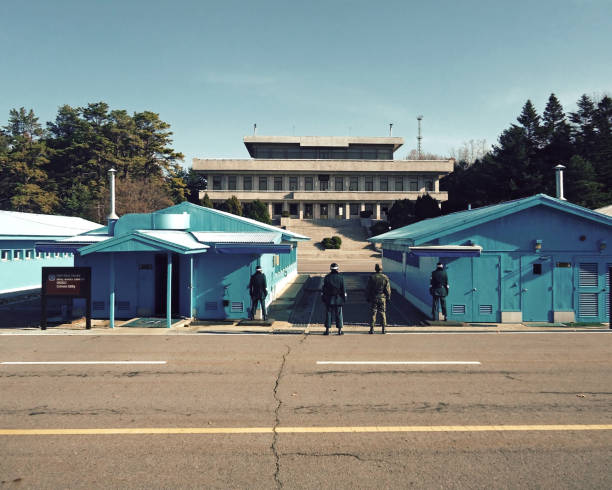 Seoul, South Korea - June 17, 2010 : A soldier stands guard in the DMZ. The armistice village of panmunjon is controlled by the united nations and among us army personnel as swedish army personnel control here. Korean civilians are not allowed here and at several moments a year delegations from both the north and the south have meetings here.