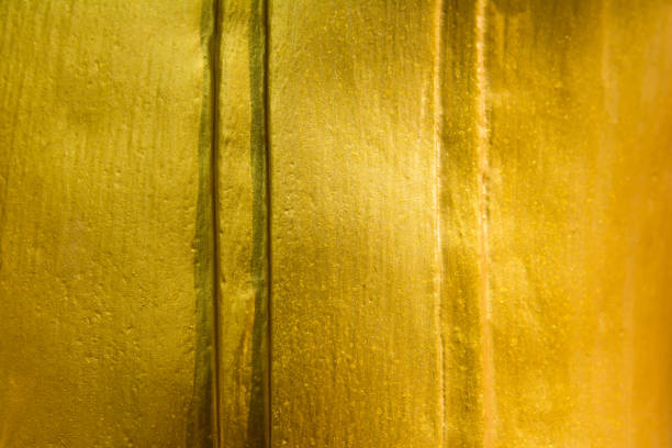 istock golden texture background.Striped golden texture 821395756