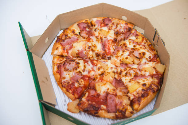 istock Delicious homemade pizza in paper box 821399348
