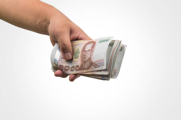 istock The Thailand money in hand ,isolate . 821406872