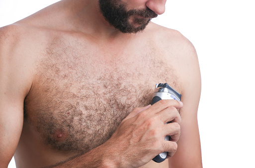 Man shaving his chest