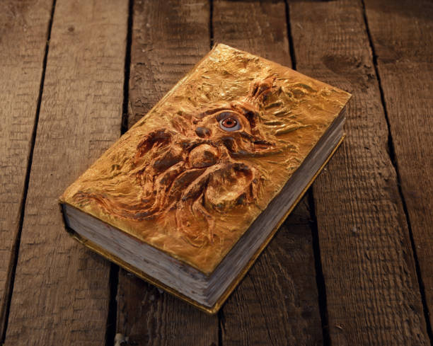 Magic book with golden cover and marine monster stock photo