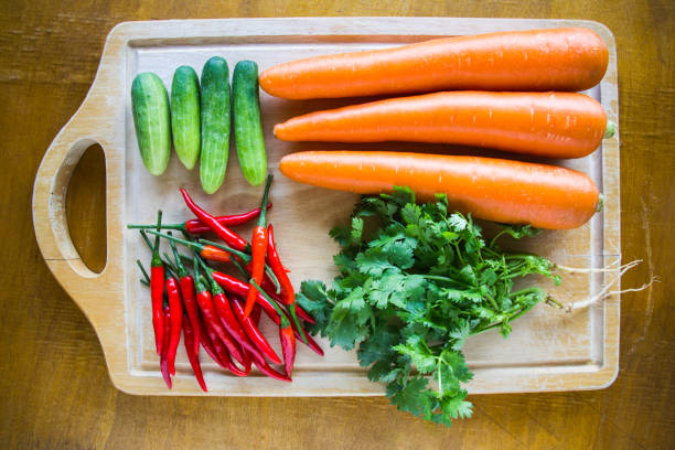 Fresh vegetables on chopping wood board