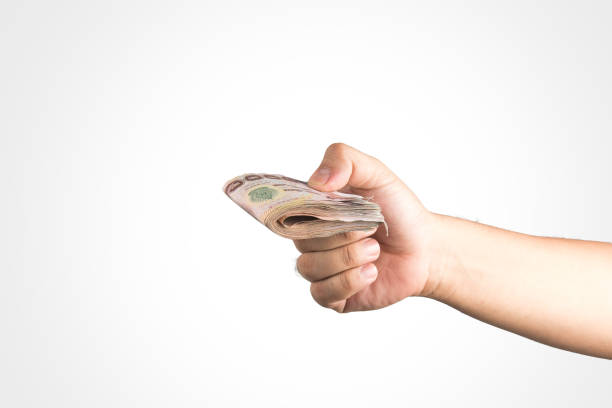 istock The Thailand money in hand ,isolate . 821411116