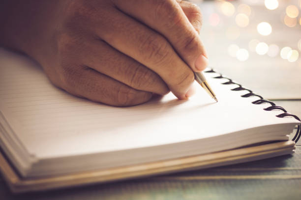 istock Writing dairy on notebook in coffee shop, concept as memory of life and education 821419108
