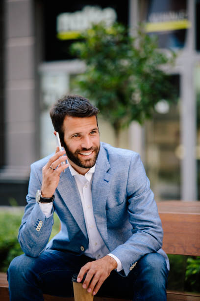 istock Young businessman having phonecall outdoors 821420020