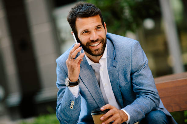 istock Young man having coffee break outdoors 821422882
