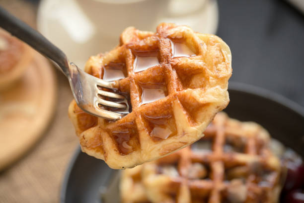 istock Coffee drink breakfast concept. Includes crispy tarts with almond, Waffles and fresh cherry 821425860
