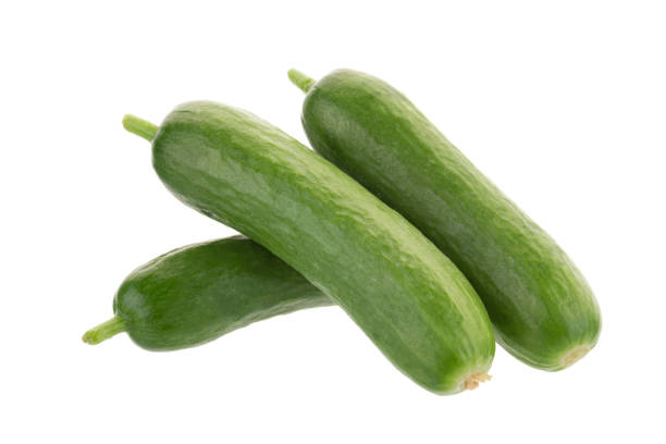 istock Organic Mini Baby Cucumbers isolated on white background 821425906