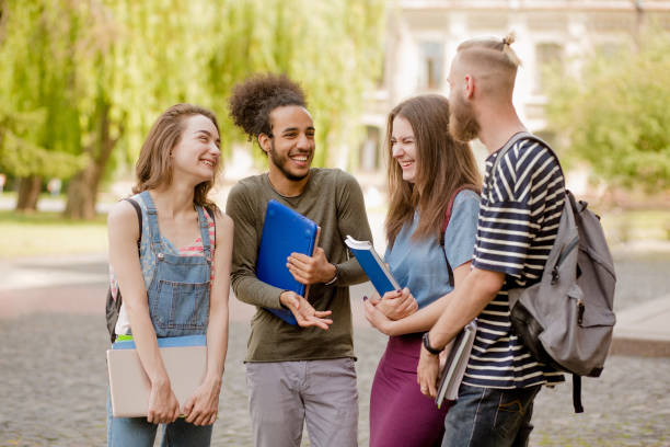 istock Multiethnic group of students having lively conversation in campus. 821427078