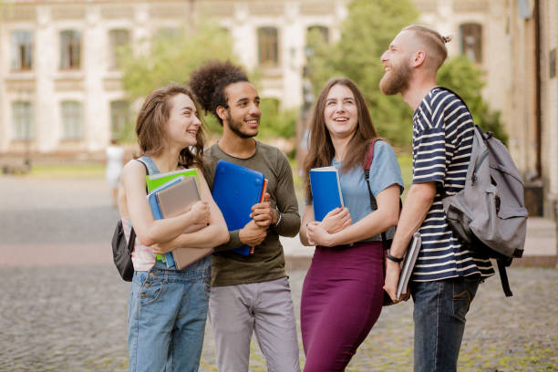 istock Cheerful young students showing emotions of happiness. 821427128