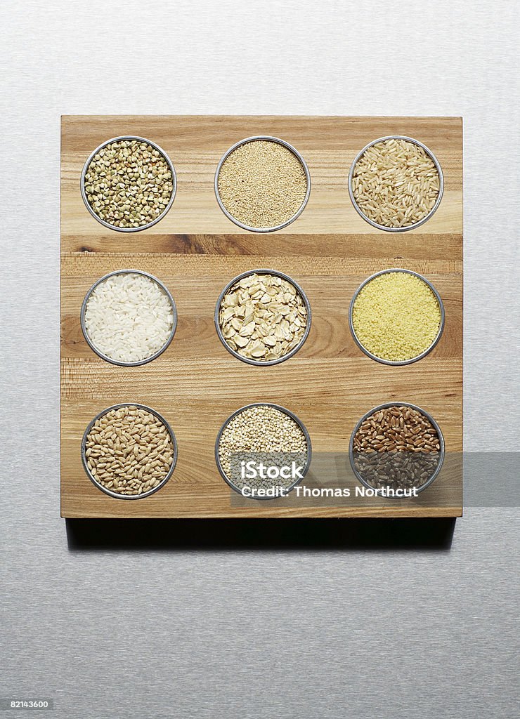 different grains amaranth quinoa buckwheat white rice couscous brown rice pearl barley rolled oats wheat berries Amaranthus Stock Photo