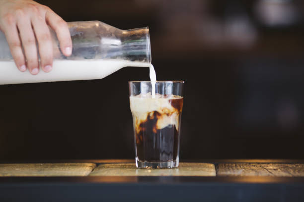 istock Pouring cream in cold brew coffee 821441610