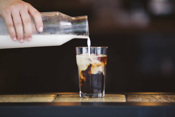 istock Pouring cream in cold brew coffee 821441708