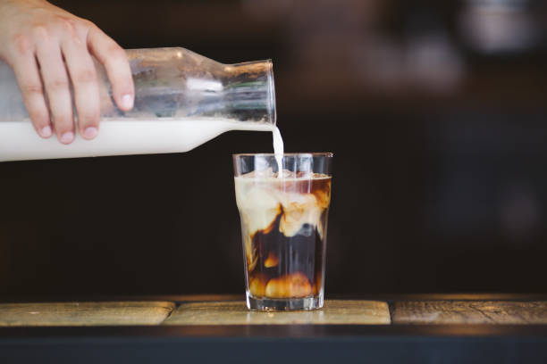 istock Pouring cream in cold brew coffee 821441750