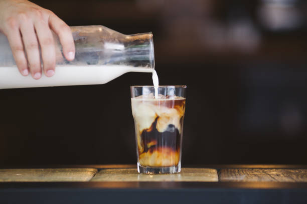 istock Pouring cream in cold brew coffee 821441804
