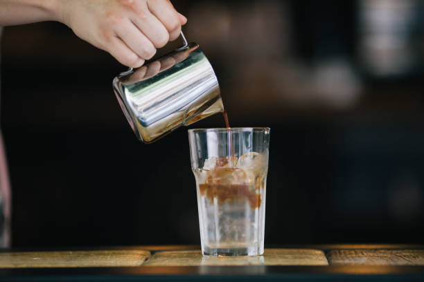 istock Barista pouring coffee for iced americana 821442012