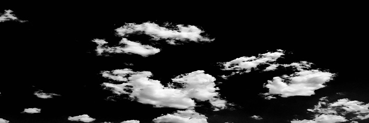 Isolated white clouds on black sky. Set of isolated clouds over black background. Design elements. White isolated clouds. Cutout extracted clouds.