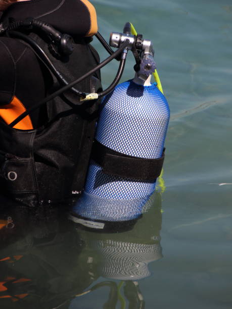 istock Scuba diving equipment on backside of Diver in Water 821453776