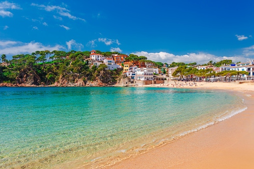 Sea landscape Llafranc near Calella de Palafrugell, Catalonia, Barcelona, Spain. Scenic old town with nice sand beach and clear blue water in bay. Famous tourist destination in Costa Brava