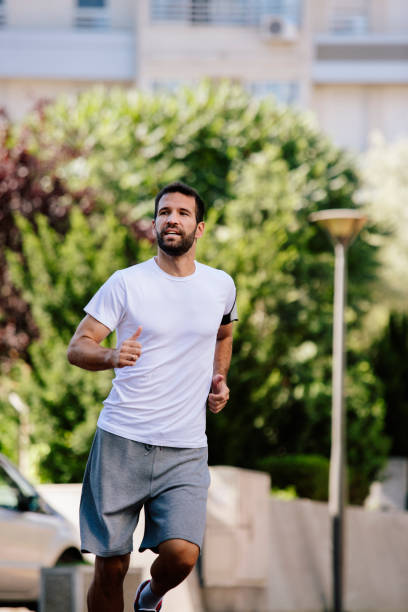 istock Young man running outdoors 821457012