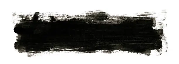 Photo of Black painted Image with brush stroke isolated on white background