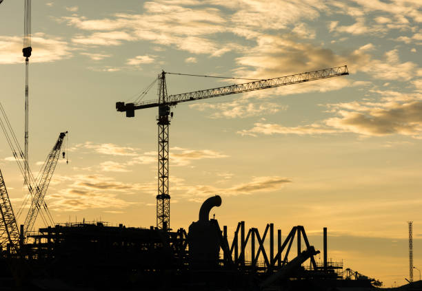 istock silhouette construction Industry oil rig refinery working site 821458026