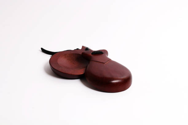 istock Spanish wooden castanets on a white background 821458454