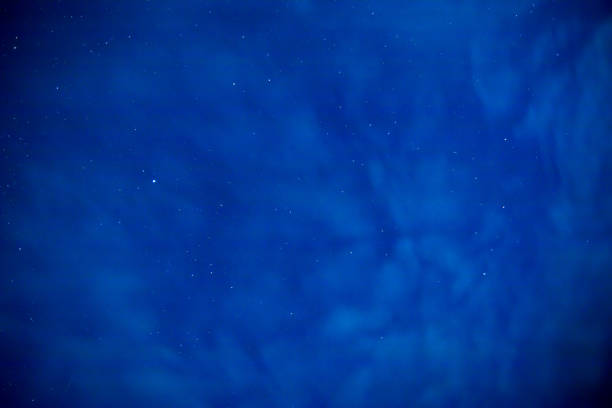 istock Beautiful starry sky with clouds on a summer night 821464484