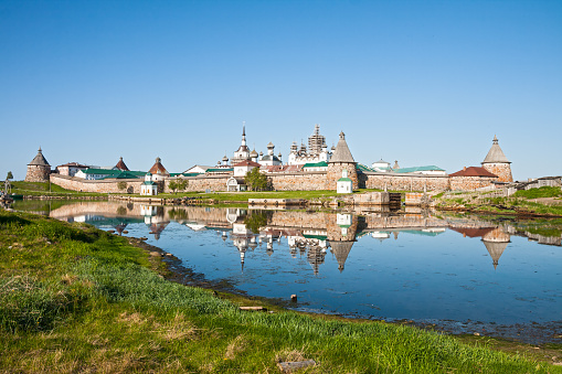 View on Solovetsky Monastery with reflection in water, Russia