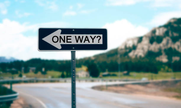 istock Road sign one way with a question mark 821470316