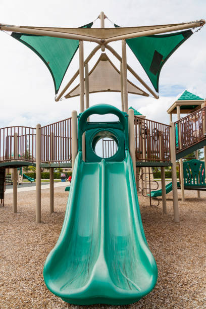 istock green slides for children on the playground 821470910