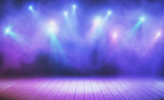 Wooden stage with blue smoke and spot lights. Presentation concept
