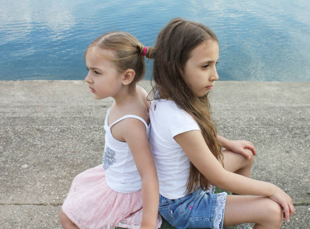 istock beautiful little sisters are angry at each other 821478896