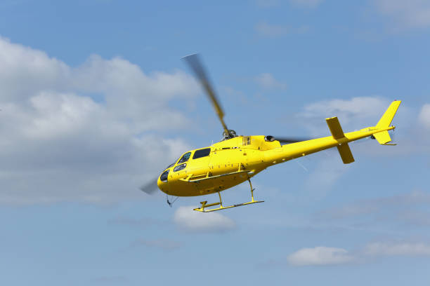 istock Rescue helicopter. Yellow helicopter flying over the terrain. 821479634