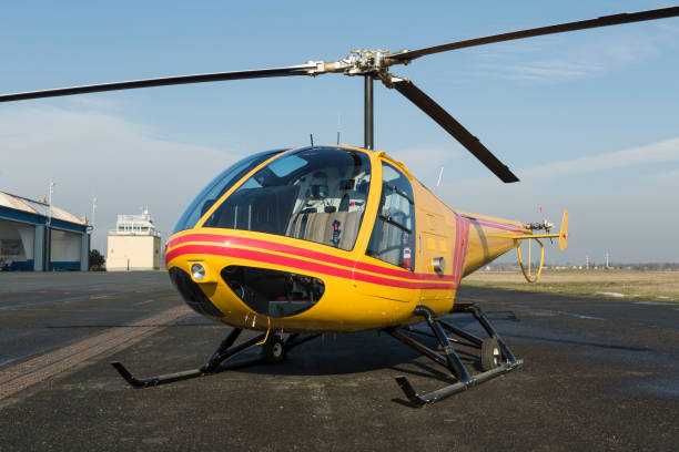 istock Helicopter rescue. Yellow helicopter on runway.  All logos and text removed. 821481978